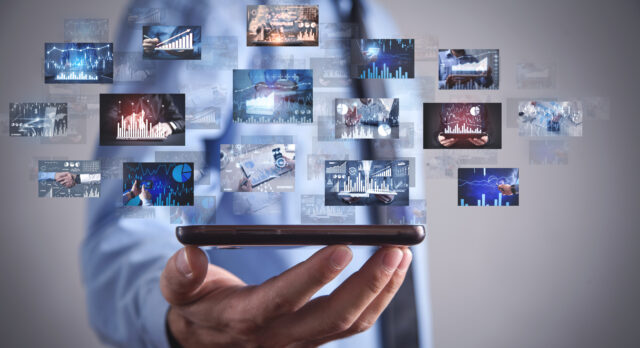 Man holding a digital pictures of business graphs. Business. Tec